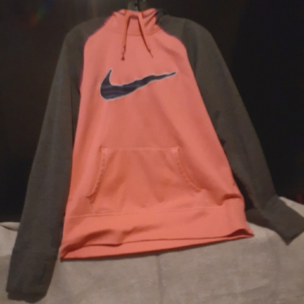 A pink Nike hoodie. It's a size L.